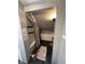 Attic bathroom featuring a tub, shower, and storage cabinet, ideal for compact spaces at 415 E 32Nd St, Indianapolis, IN 46205