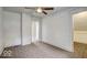 Bright bedroom with carpet, featuring a connecting room and ample natural light at 415 E 32Nd St, Indianapolis, IN 46205