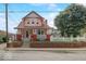 Charming two-story home featuring a welcoming front porch and well-maintained brick accents at 415 E 32Nd St, Indianapolis, IN 46205