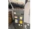 Close-up of the furnace, with visible brand sticker and energy guide information at 415 E 32Nd St, Indianapolis, IN 46205