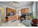 Traditional kitchen with wooden cabinets, black appliances, and an eat-in breakfast nook at 415 E 32Nd St, Indianapolis, IN 46205