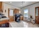 Bright kitchen featuring warm wood cabinetry and black appliances, complemented by natural light at 415 E 32Nd St, Indianapolis, IN 46205