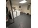 Functional basement laundry area with washer, dryer, sink, and ample space for chores at 415 E 32Nd St, Indianapolis, IN 46205