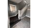 Gray staircase with white trim and natural light coming through a window above the stairs at 415 E 32Nd St, Indianapolis, IN 46205