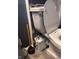 Close-up of a toilet with gray walls, highlighting plumbing and fixtures at 415 E 32Nd St, Indianapolis, IN 46205