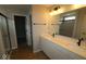 Modern bathroom featuring a double vanity with black fixtures and a glass-enclosed shower at 4152 Dutton Dr, Bargersville, IN 46106