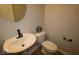 Half bath featuring a pedestal sink and a standard toilet at 4152 Dutton Dr, Bargersville, IN 46106