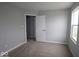 Clean bedroom featuring neutral carpet and gray walls, with ample natural light at 4152 Dutton Dr, Bargersville, IN 46106