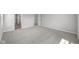 Spacious bedroom showcasing plush gray carpet, neutral walls, and ample natural light at 4152 Dutton Dr, Bargersville, IN 46106