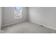 Cozy bedroom with neutral carpet and ample natural light from a large window at 4152 Dutton Dr, Bargersville, IN 46106