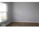 Bedroom with a large window and hardwood floors at 4152 Dutton Dr, Bargersville, IN 46106