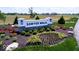 Landscaped entrance sign for Sawyer Walk, surrounded by colorful flower beds at 4152 Dutton Dr, Bargersville, IN 46106