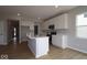 Bright kitchen with white cabinets, an island with a sink, and stainless steel appliances at 4152 Dutton Dr, Bargersville, IN 46106
