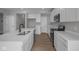 Bright kitchen features stainless appliances, recessed lighting, white cabinets and a center island at 4152 Dutton Dr, Bargersville, IN 46106