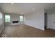 Open-concept living room with a fireplace and hardwood floors at 4152 Dutton Dr, Bargersville, IN 46106