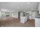 Spacious living room with hardwood floors, a modern fireplace, recessed lighting and a bright white kitchen at 4152 Dutton Dr, Bargersville, IN 46106