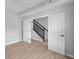 Wood staircase featuring a black railing and white trim, with wood flooring at 4152 Dutton Dr, Bargersville, IN 46106