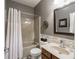 Bathroom with a tub/shower combo, wood vanity, and decorative mirror at 4631 Belair Cir, Plainfield, IN 46168