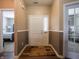 Inviting foyer with hardwood floors leading to various rooms, providing a welcoming first impression at 4631 Belair Cir, Plainfield, IN 46168