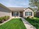 Well-maintained home featuring a neat front lawn and walkway leading to the welcoming porch at 4631 Belair Cir, Plainfield, IN 46168