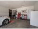 Well-organized garage space with work area, shelving, and overhead lighting at 4631 Belair Cir, Plainfield, IN 46168