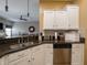 Kitchen featuring granite countertop, stainless steel appliances and view of the living room at 4631 Belair Cir, Plainfield, IN 46168