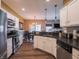 Bright kitchen with stainless steel appliances, stone backsplash, and ample cabinet space at 4631 Belair Cir, Plainfield, IN 46168