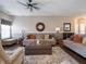 Warm living room features hardwood floors and comfy seating, creating an inviting atmosphere at 4631 Belair Cir, Plainfield, IN 46168