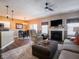 Open-concept living area with hardwood floors, a fireplace, and easy access to the kitchen at 4631 Belair Cir, Plainfield, IN 46168