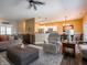 Bright and airy living space with hardwood floors and an open connection to the kitchen and dining area at 4631 Belair Cir, Plainfield, IN 46168