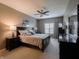 Spacious main bedroom with large bed, ceiling fan, dresser, and large windows allowing ample light at 4631 Belair Cir, Plainfield, IN 46168