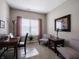 Bright home office featuring neutral walls, and a work space with a desk and comfortable seating at 4631 Belair Cir, Plainfield, IN 46168