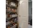 Walk-in pantry with wire shelving stocked with canned goods and other food items at 4631 Belair Cir, Plainfield, IN 46168