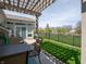 Cozy patio area with pergola, outdoor seating, table, and lush green lawn, perfect for outdoor relaxation and enjoyment at 4631 Belair Cir, Plainfield, IN 46168