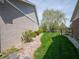 Side yard with manicured landscaping and greenery, providing a private outdoor area at 4631 Belair Cir, Plainfield, IN 46168