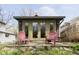Charming backyard retreat with patio and colorful seating at 5110 Riverview Dr, Indianapolis, IN 46208