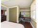 Functional bedroom area includes built-in shelving, a desk, and ample closet space at 5110 Riverview Dr, Indianapolis, IN 46208