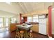 Well-lit kitchen with stainless steel appliances, an island, and wood floors at 5110 Riverview Dr, Indianapolis, IN 46208