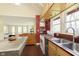 Kitchen with an island, stainless steel appliances and beautiful hardwood floors at 5110 Riverview Dr, Indianapolis, IN 46208