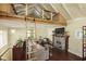 Inviting living room boasts a cozy stone fireplace and a charming ladder leading to a loft area at 5110 Riverview Dr, Indianapolis, IN 46208