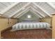Cozy loft bedroom featuring a low-profile bed, wooden floors, and built-in storage at 5110 Riverview Dr, Indianapolis, IN 46208