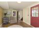 Mudroom with a comfortable chair, a patterned rug and a charming window to the yard at 5110 Riverview Dr, Indianapolis, IN 46208