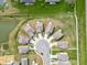 An aerial view of a cul-de-sac featuring modern homes with manicured lawns at 5218 Triple Crown Way, Indianapolis, IN 46237