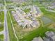 Well-planned suburban community features lush landscaping and calming ponds, captured from an aerial perspective at 5218 Triple Crown Way, Indianapolis, IN 46237