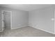 Bedroom featuring a walk-in closet, neutral walls, and new carpet at 5218 Triple Crown Way, Indianapolis, IN 46237