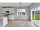 Kitchen area showing white cabinets and sliding door at 5218 Triple Crown Way, Indianapolis, IN 46237
