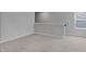 Upstairs loft with neutral paint, carpet, and natural light coming through a window with privacy blinds at 5218 Triple Crown Way, Indianapolis, IN 46237