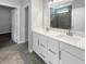 Elegant bathroom with dual vanity sinks, modern fixtures, and a glass-enclosed shower at 5267 Chambers Ct, McCordsville, IN 46055