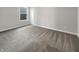 Cozy bedroom with neutral carpet and a large window for natural light at 5267 Chambers Ct, McCordsville, IN 46055
