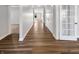 Bright hallway with hardwood floors, leading to various rooms in the house at 5267 Chambers Ct, McCordsville, IN 46055